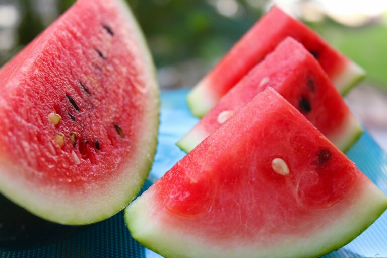 sliced watermelon on white table